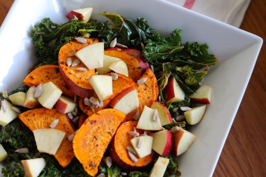 Warm salad with roasted kale, sweet potatoes, apples, and sunflower seeds